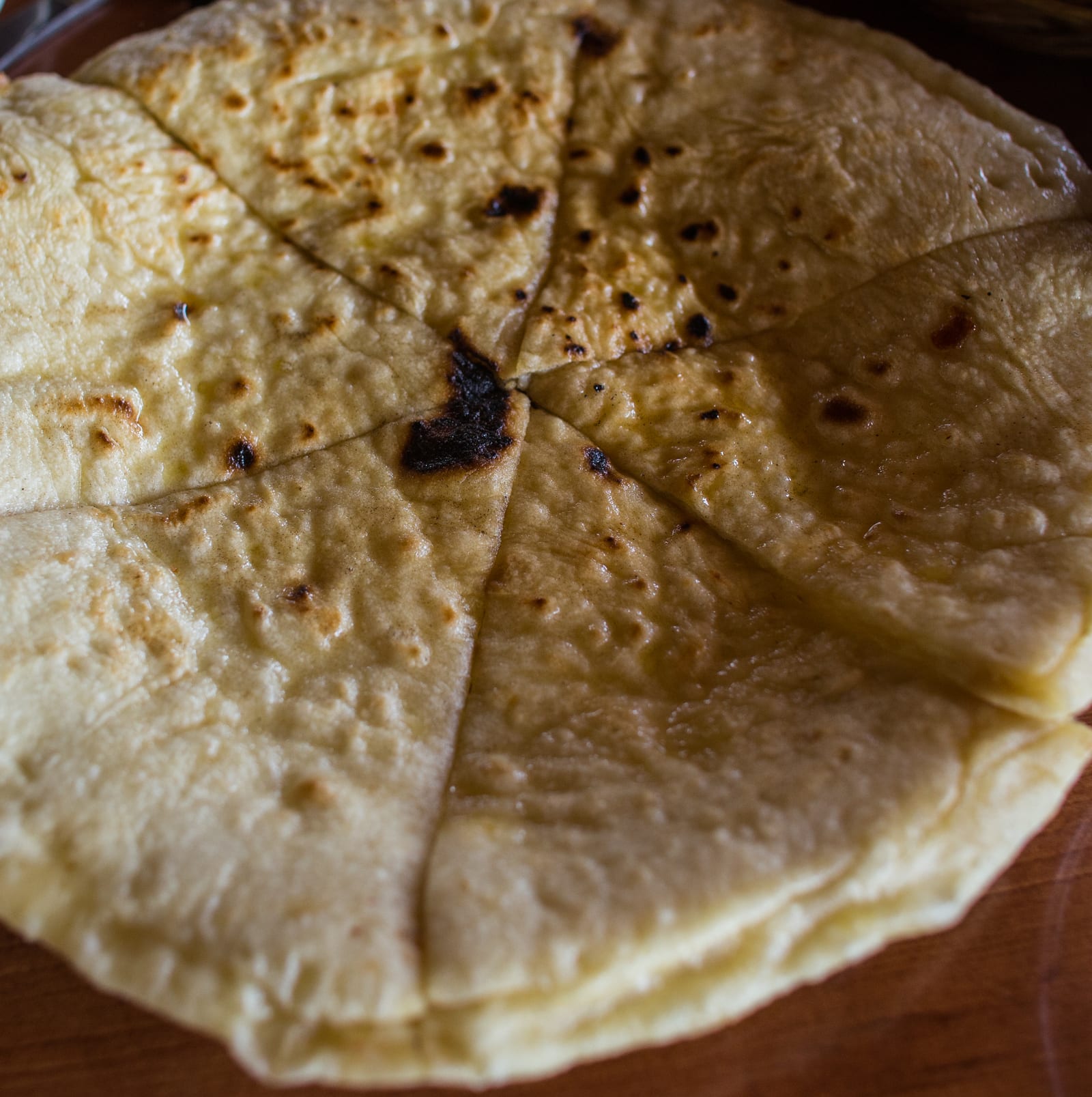 Slices of Georgian khachapuri cheese bread on a plate.