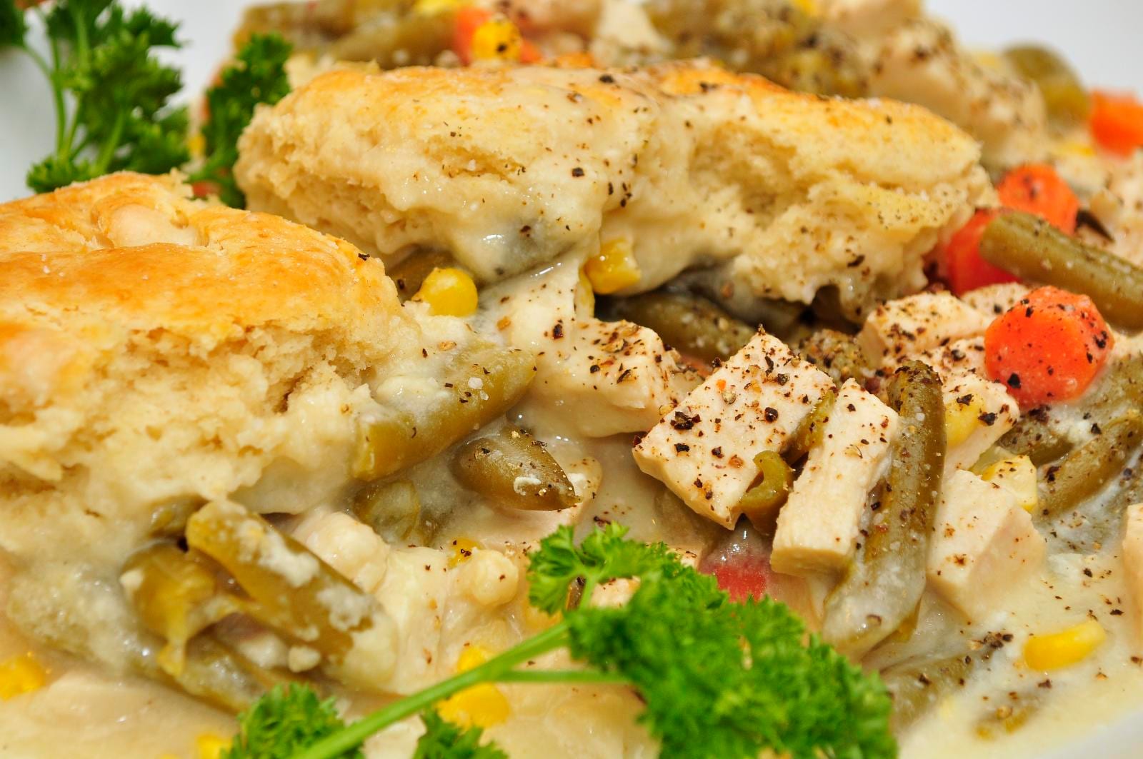 Biscuit-topped chicken and vegetables in creamy gravy.