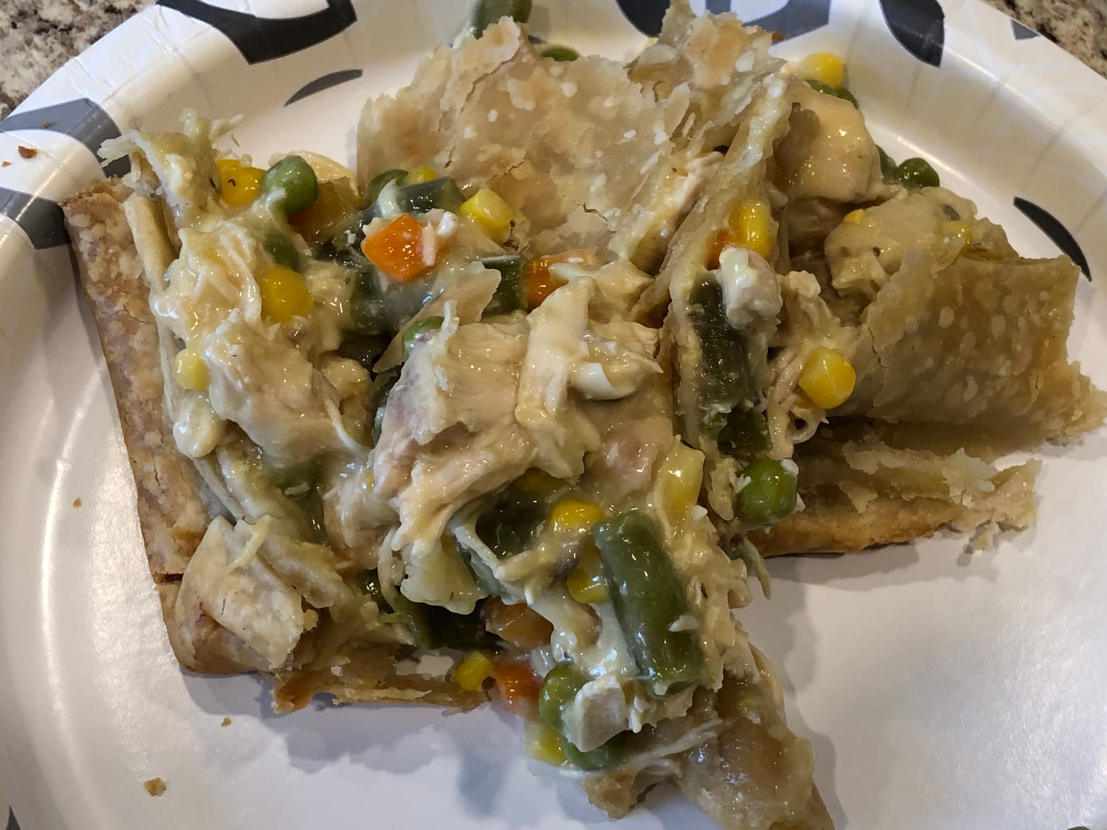 A serving of chicken casserole with creamy gravy and a browned top.