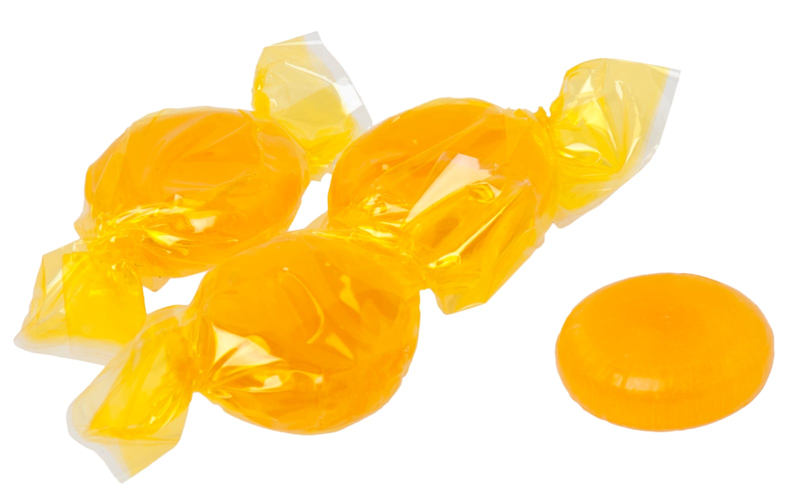 Golden butterscotch hard candies in clear yellow wrappers on a white background.