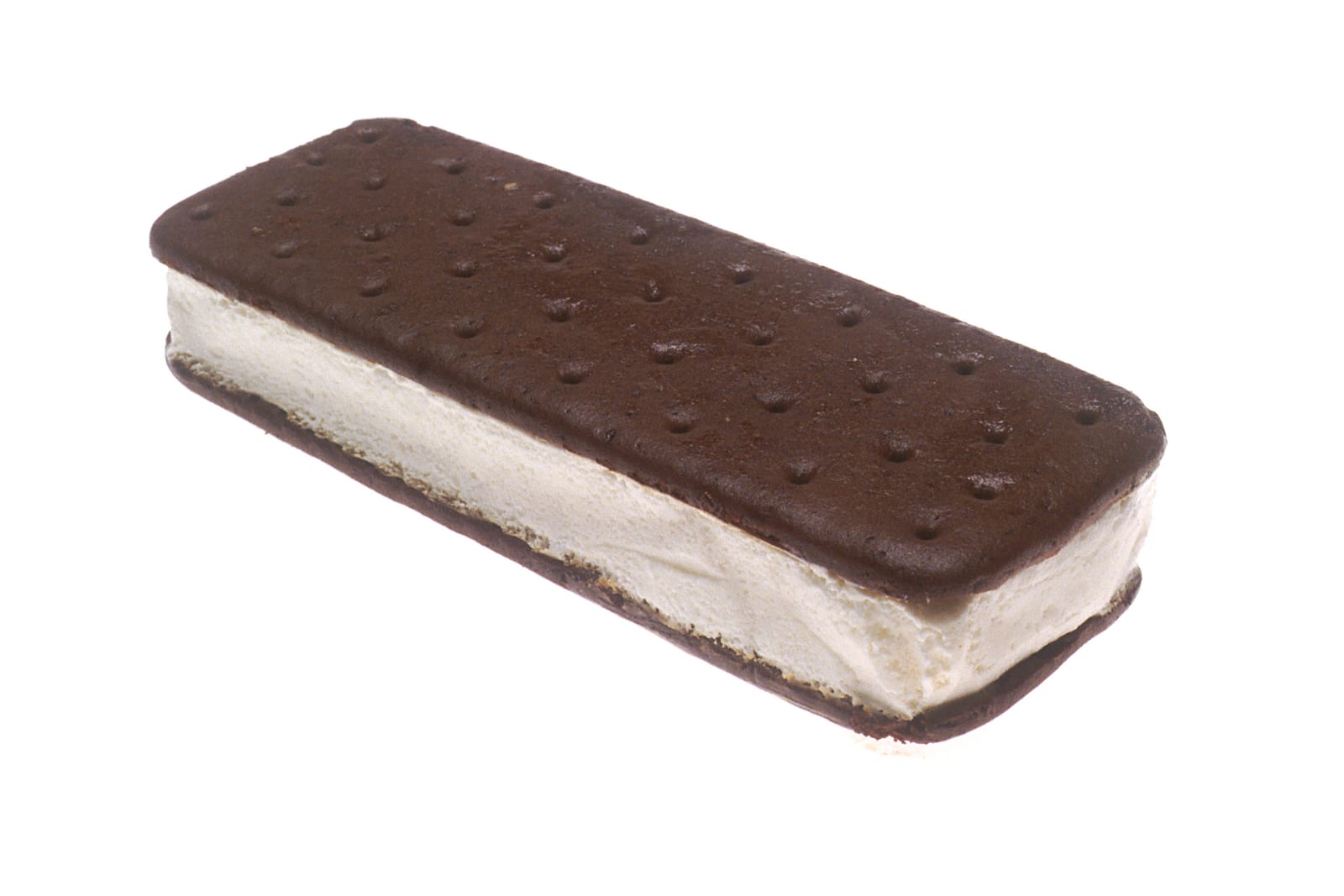 A rectangular vanilla ice cream sandwich between two chocolate wafers on white.