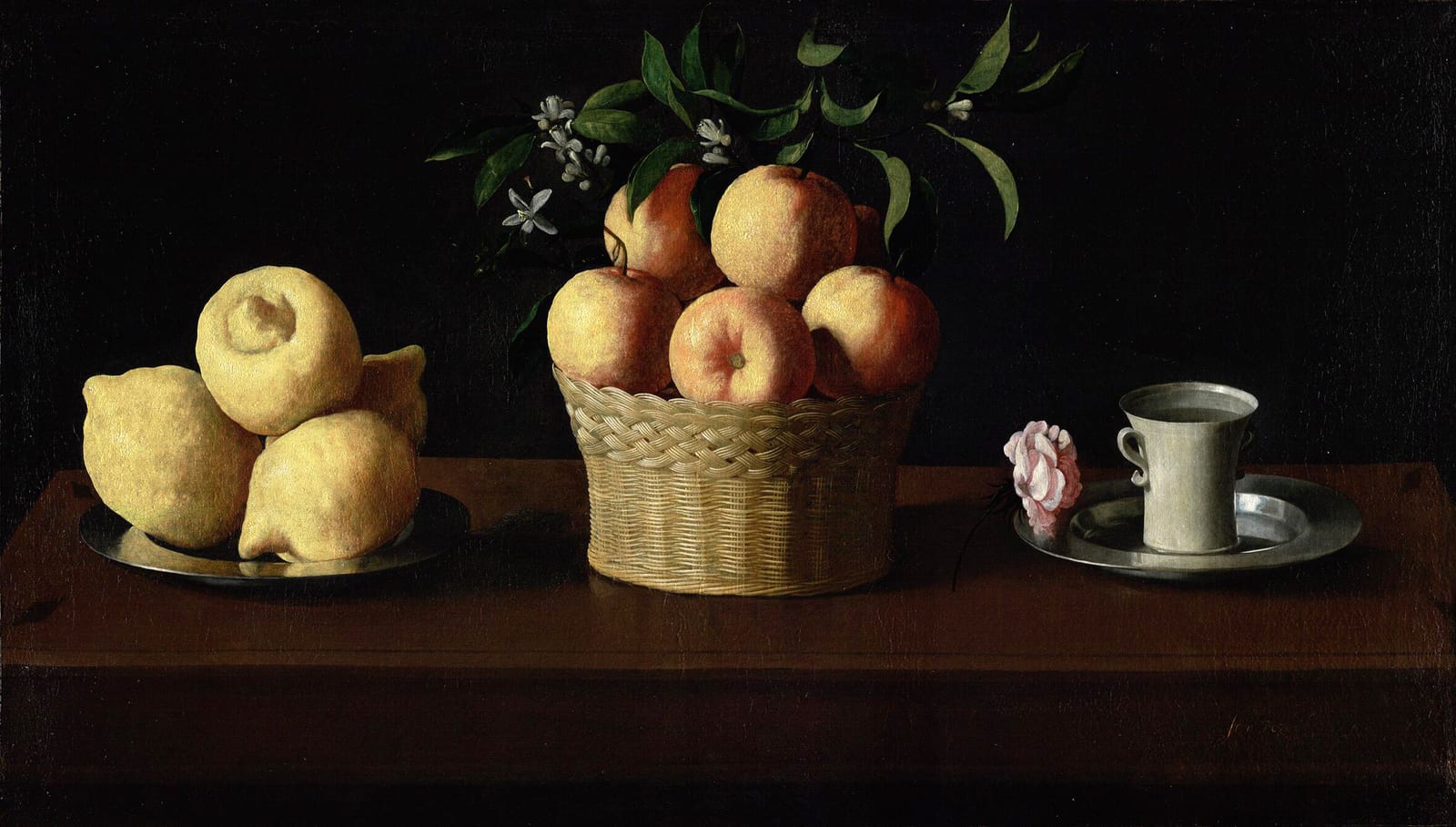 Lemons, oranges, orange blossoms, and a rose arranged on a dark table in a 1633 still life.