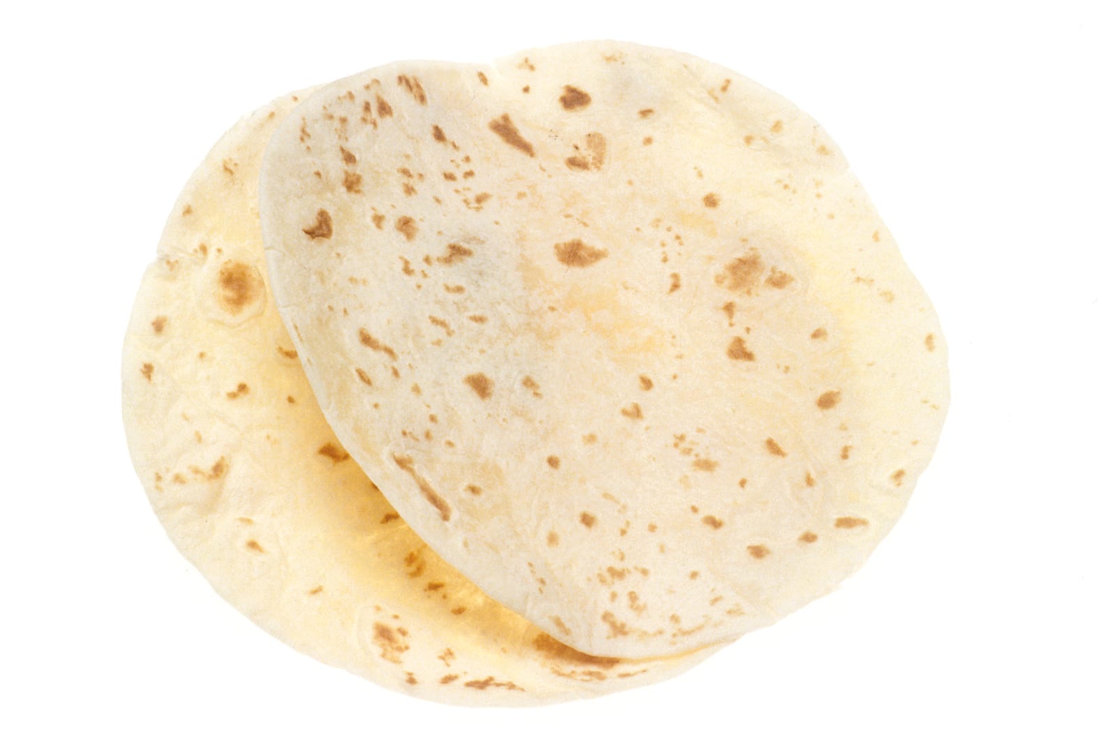 Two cooked flour tortillas overlapping on a white background.