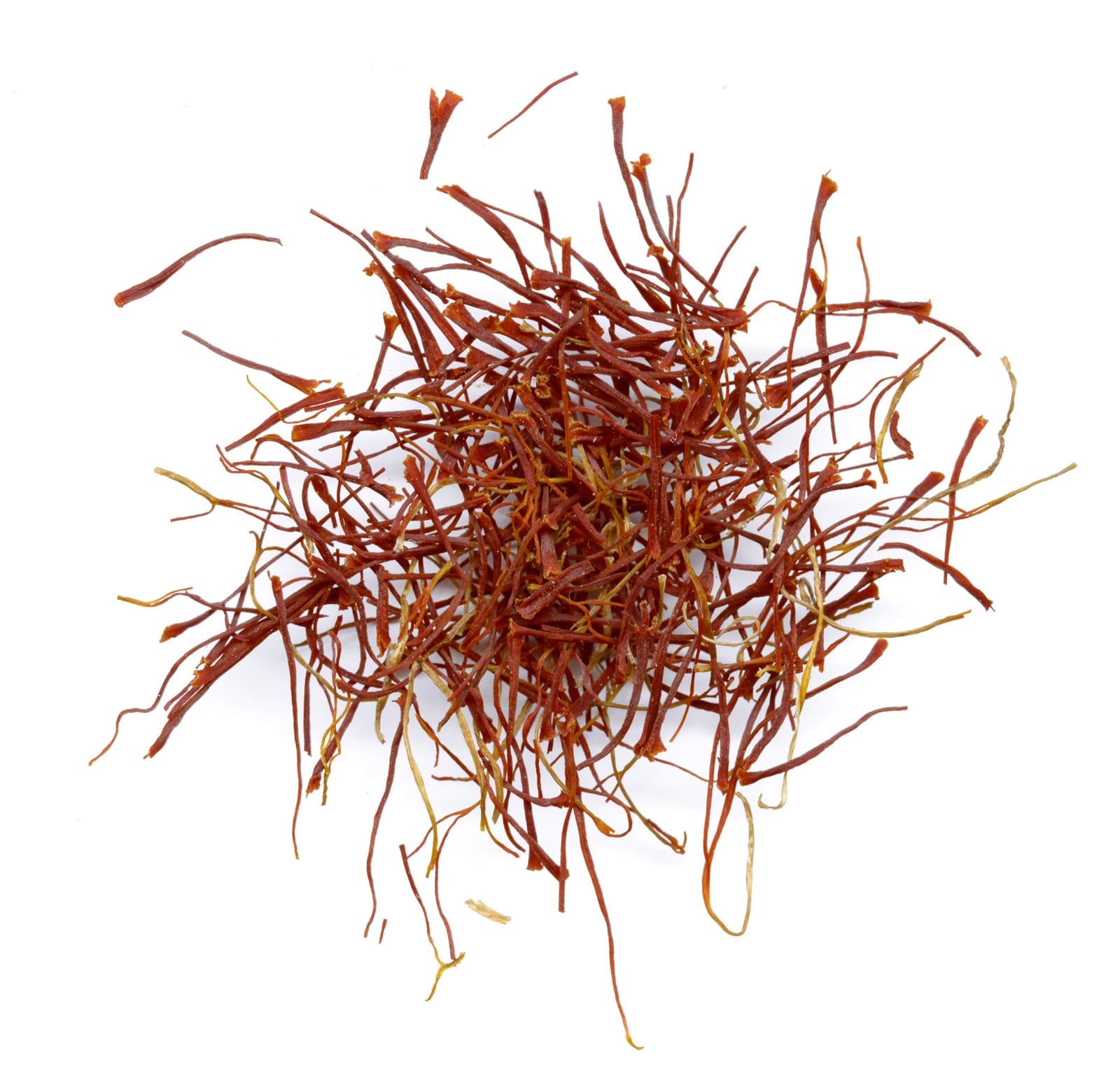 A loose pile of deep red saffron threads against a white background.